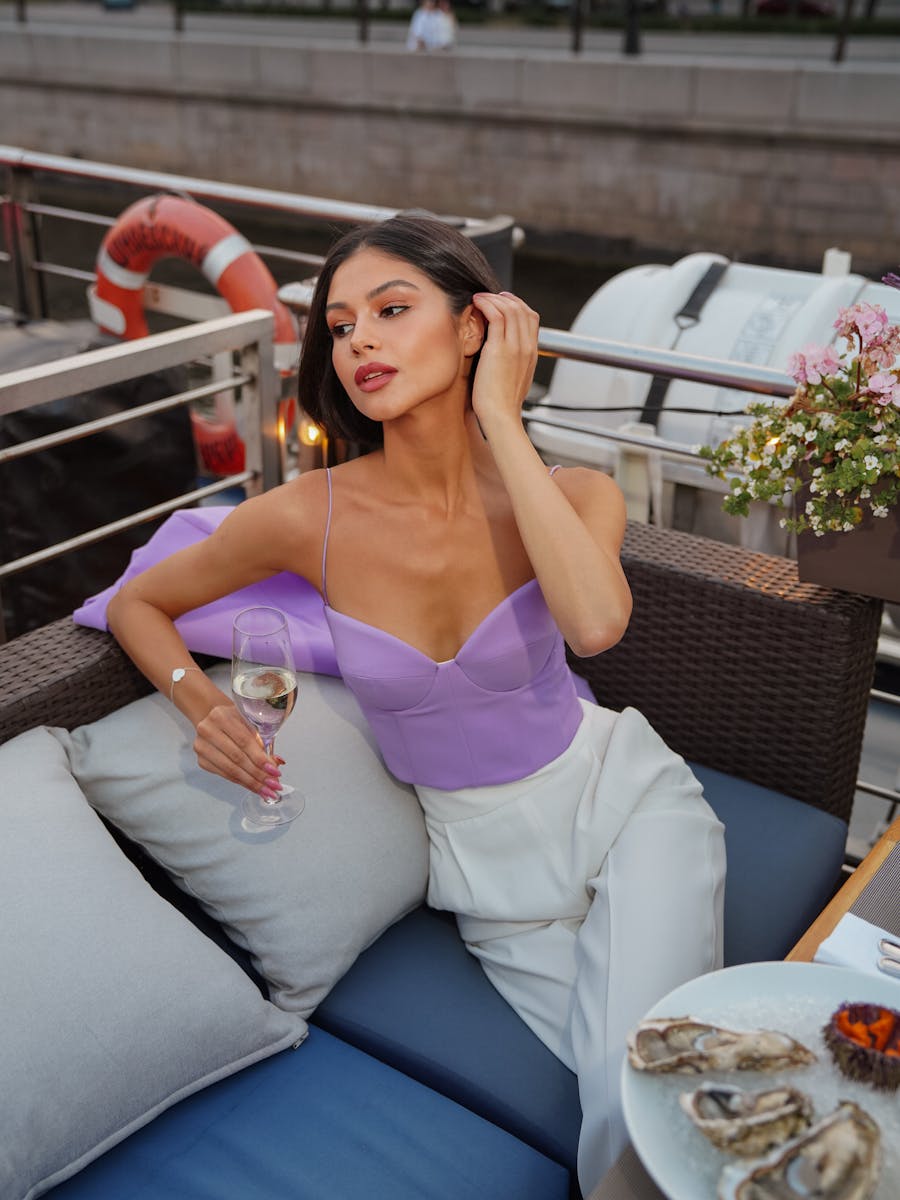 Attractive Brunette on Boat with Glass of Champagne